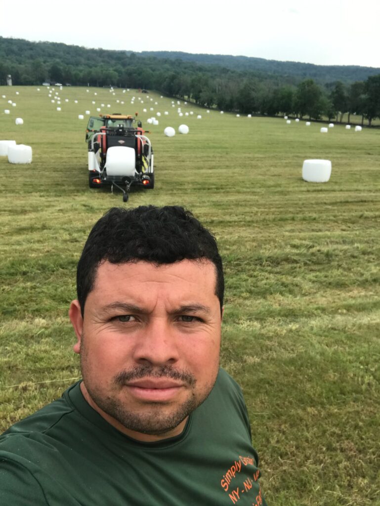 Selvin Gomez on NJ farm after first hay cutting of 2022